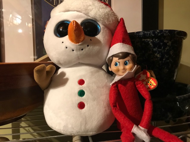 Shawn Anderson Elf with snowman.jpg