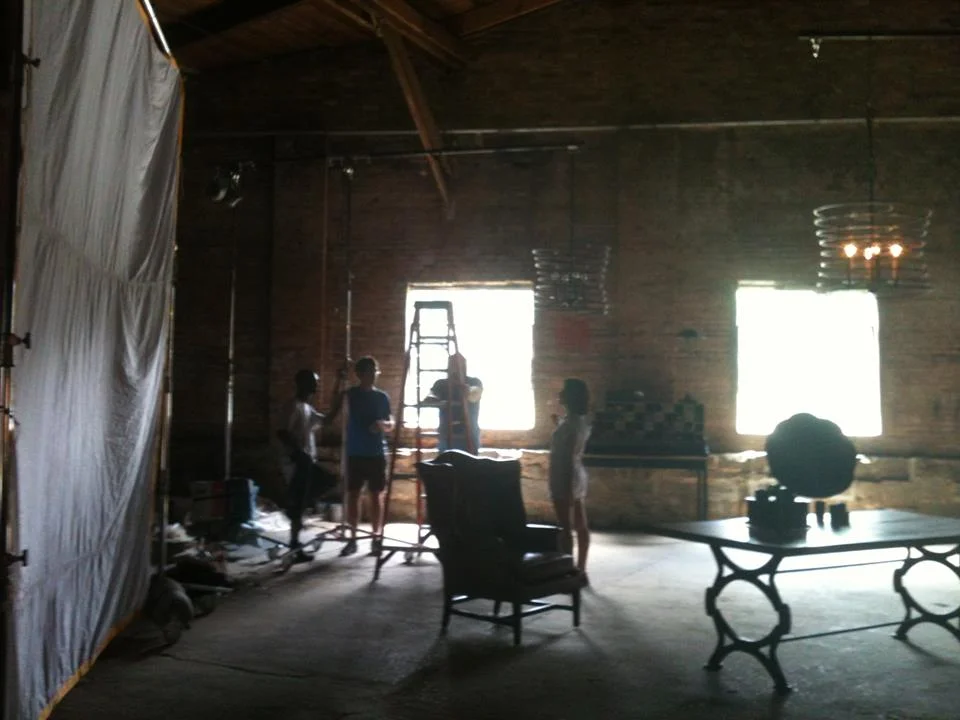 Setting up a shot in the spacious old cotton warehouse.