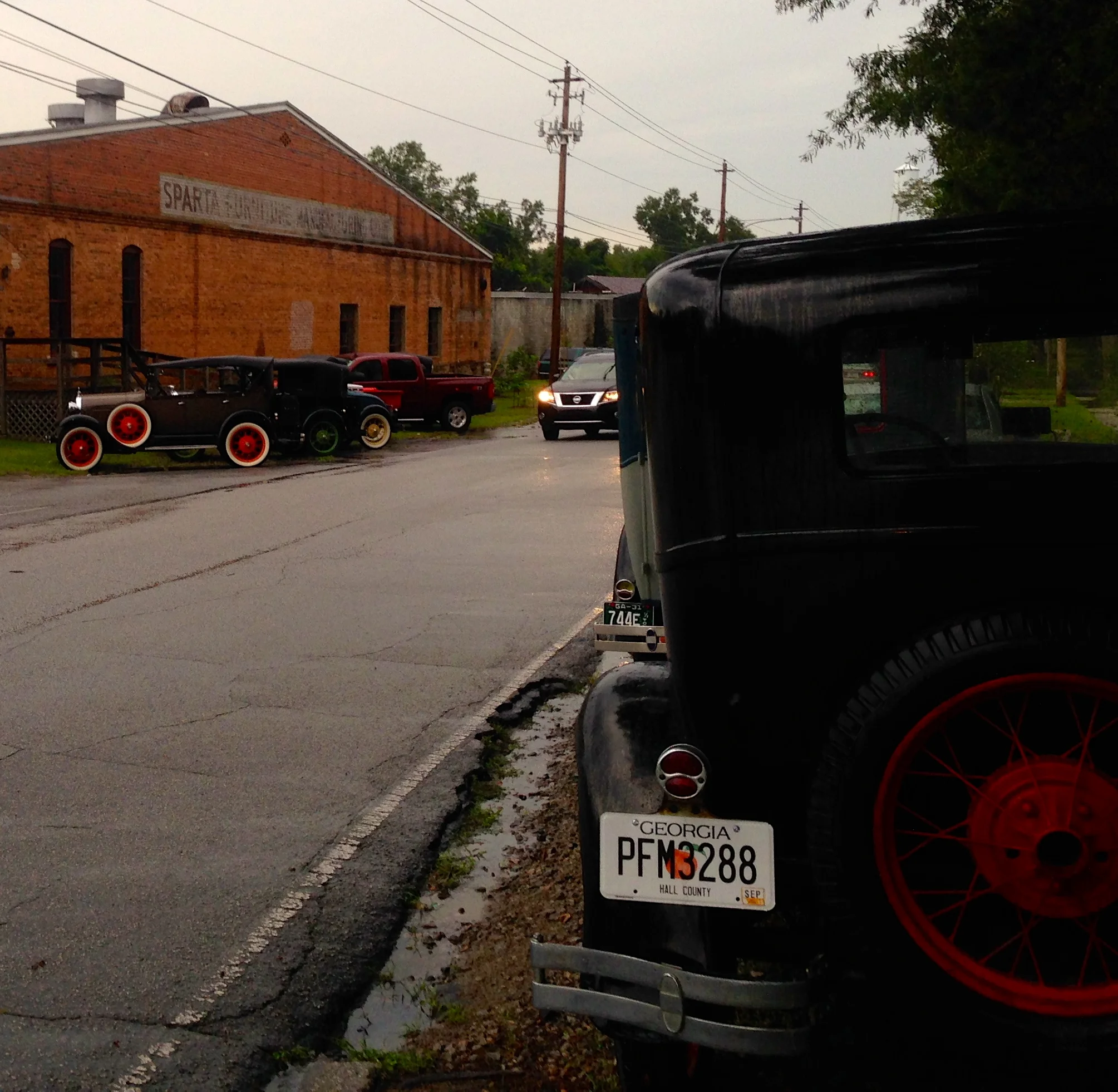 There were a few of the cars parked by the side of the house and by the old cotton warehouse building where Sparta Mushrooms are raised. 