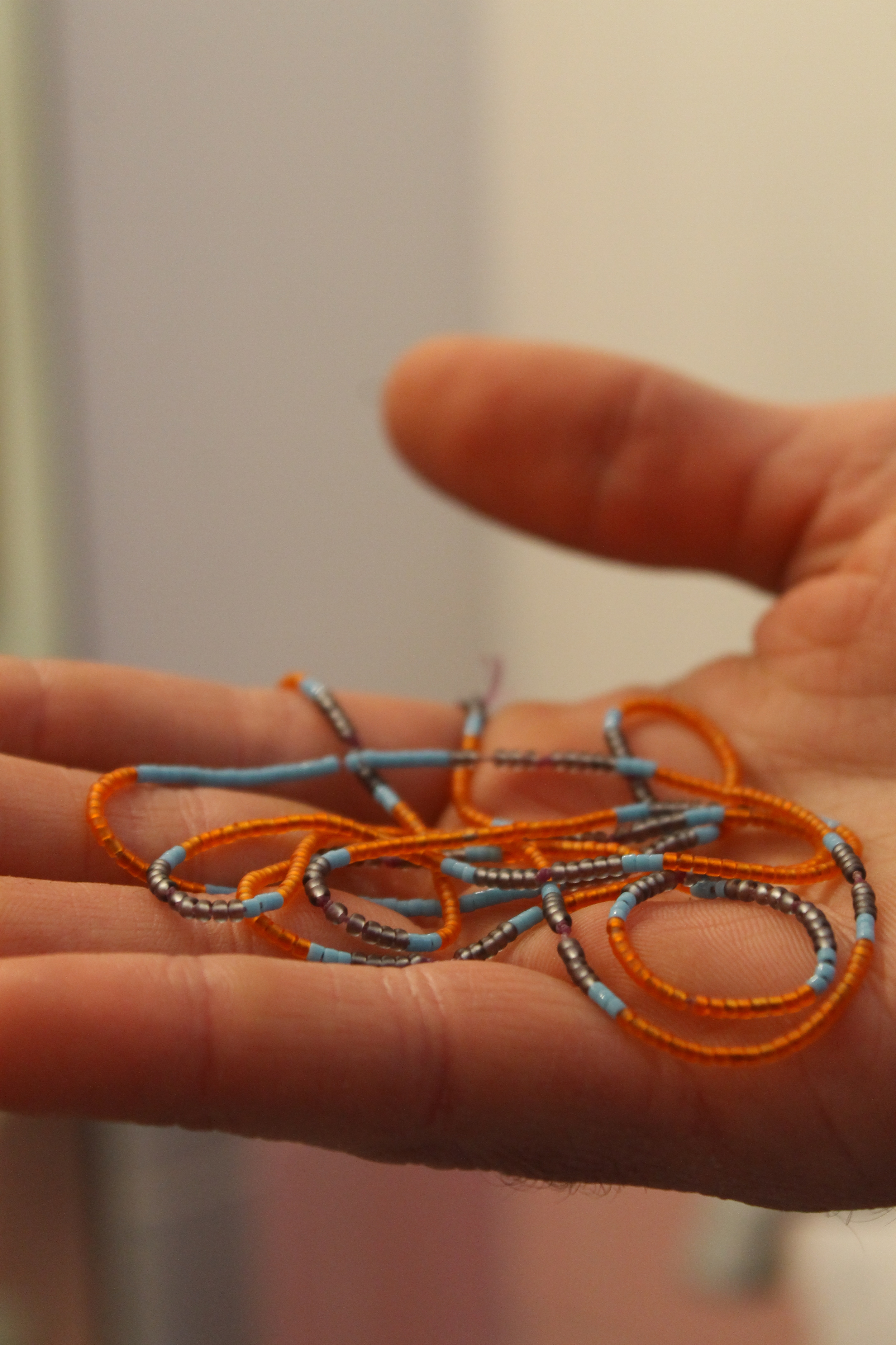 When asked about a meaningful object in his house Ben produced this necklace his wife Lisa made for him. Photo by Jakob Lewis