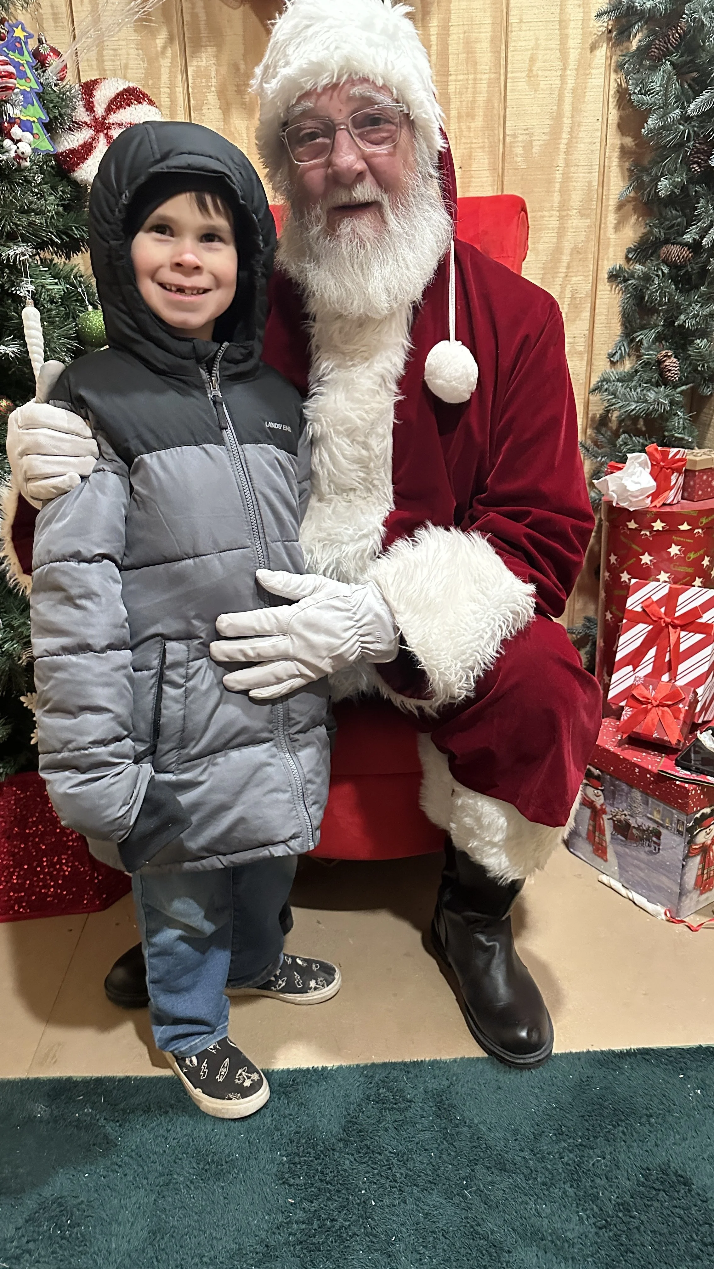 Isaac meeting Santa Claus during the Christmas season.