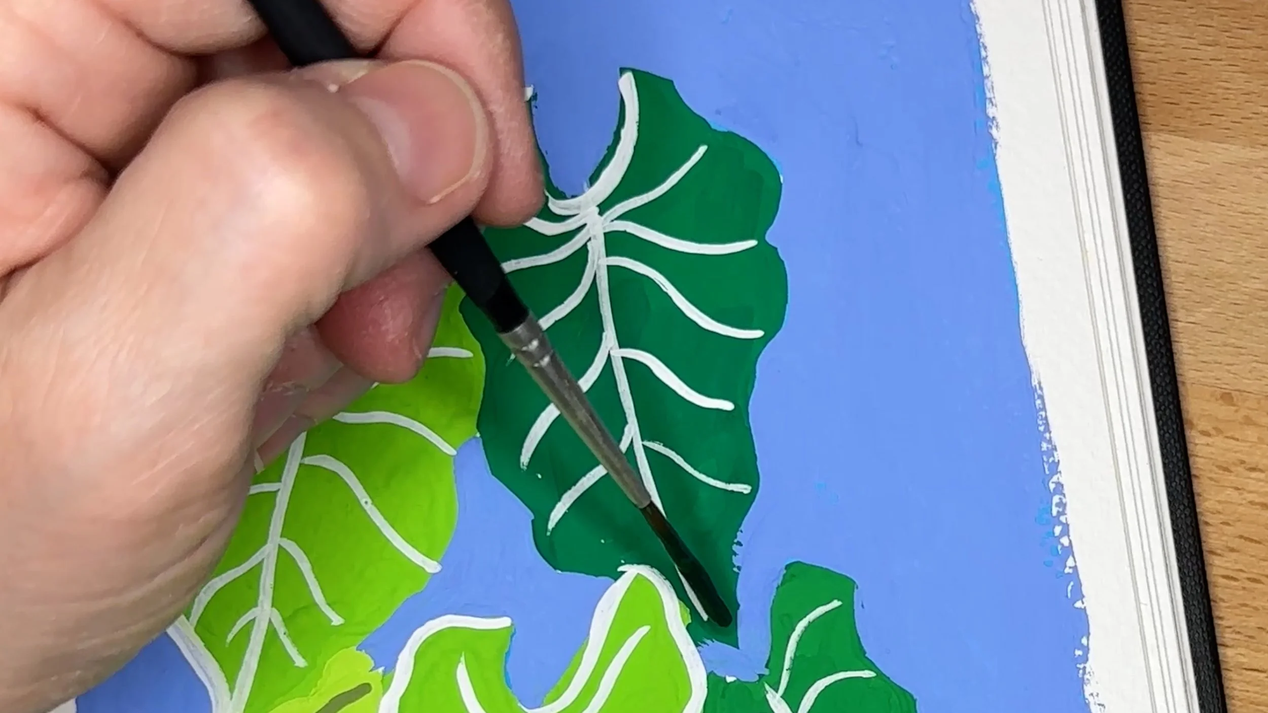 Close up detail of gouache painted leaves showing texture and brushwork