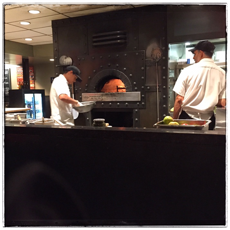 Wood-fired pizza served at Red Rocks