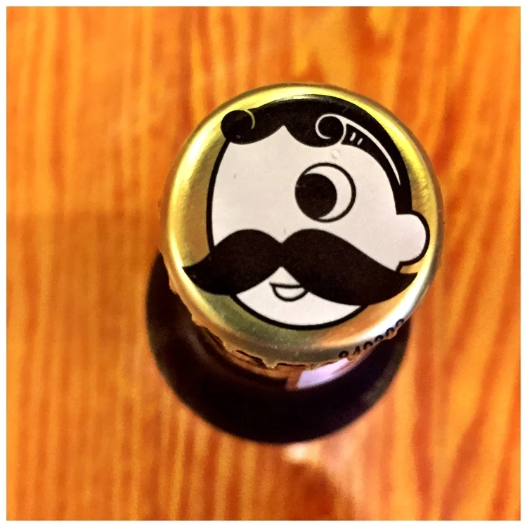The iconic Natty Boh man still sits atop a bottle of beer.