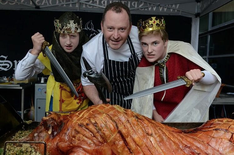 Neil and the pupils get stuck into a hog roast