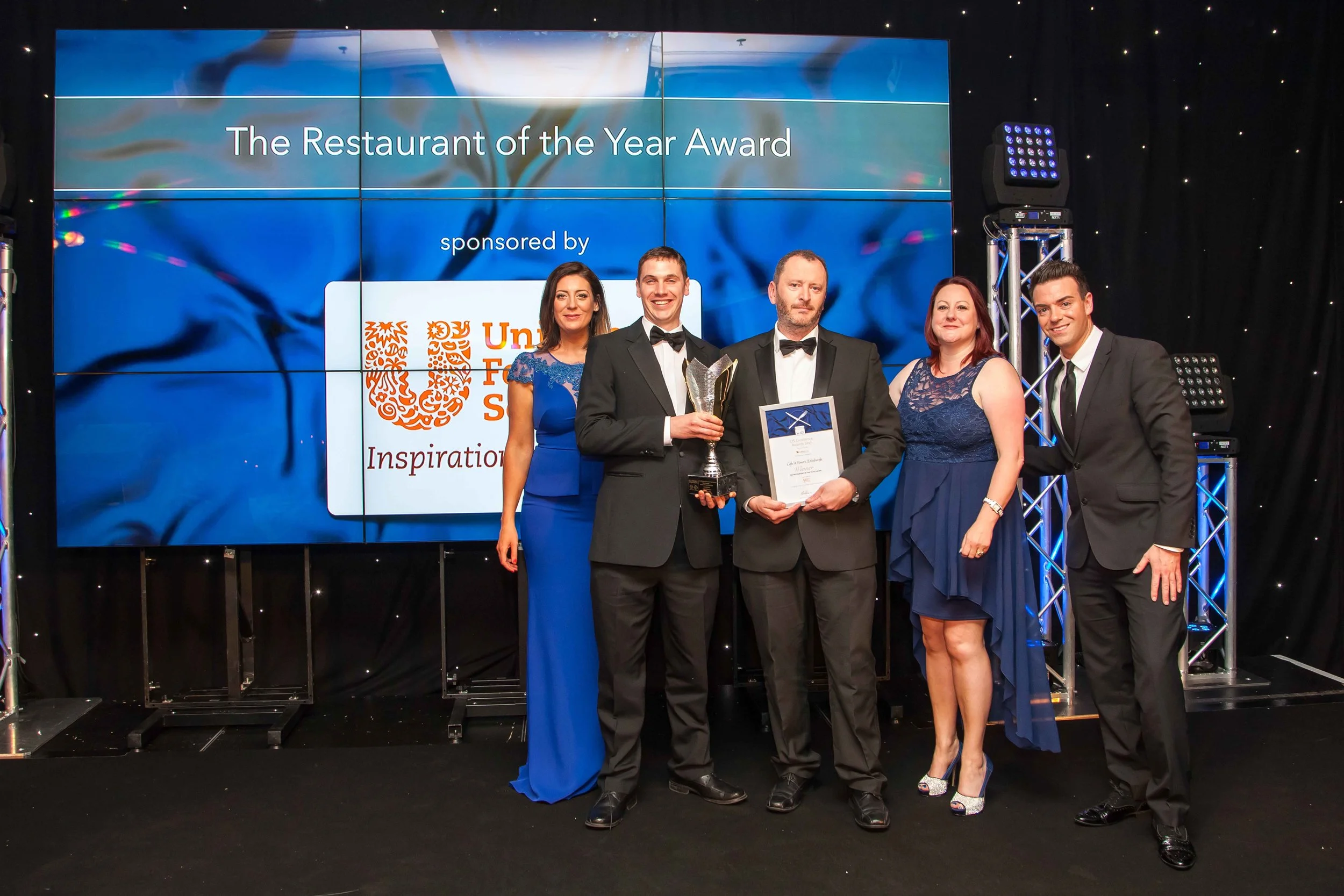 Neil Forbes and Joe Simpson collecting the award