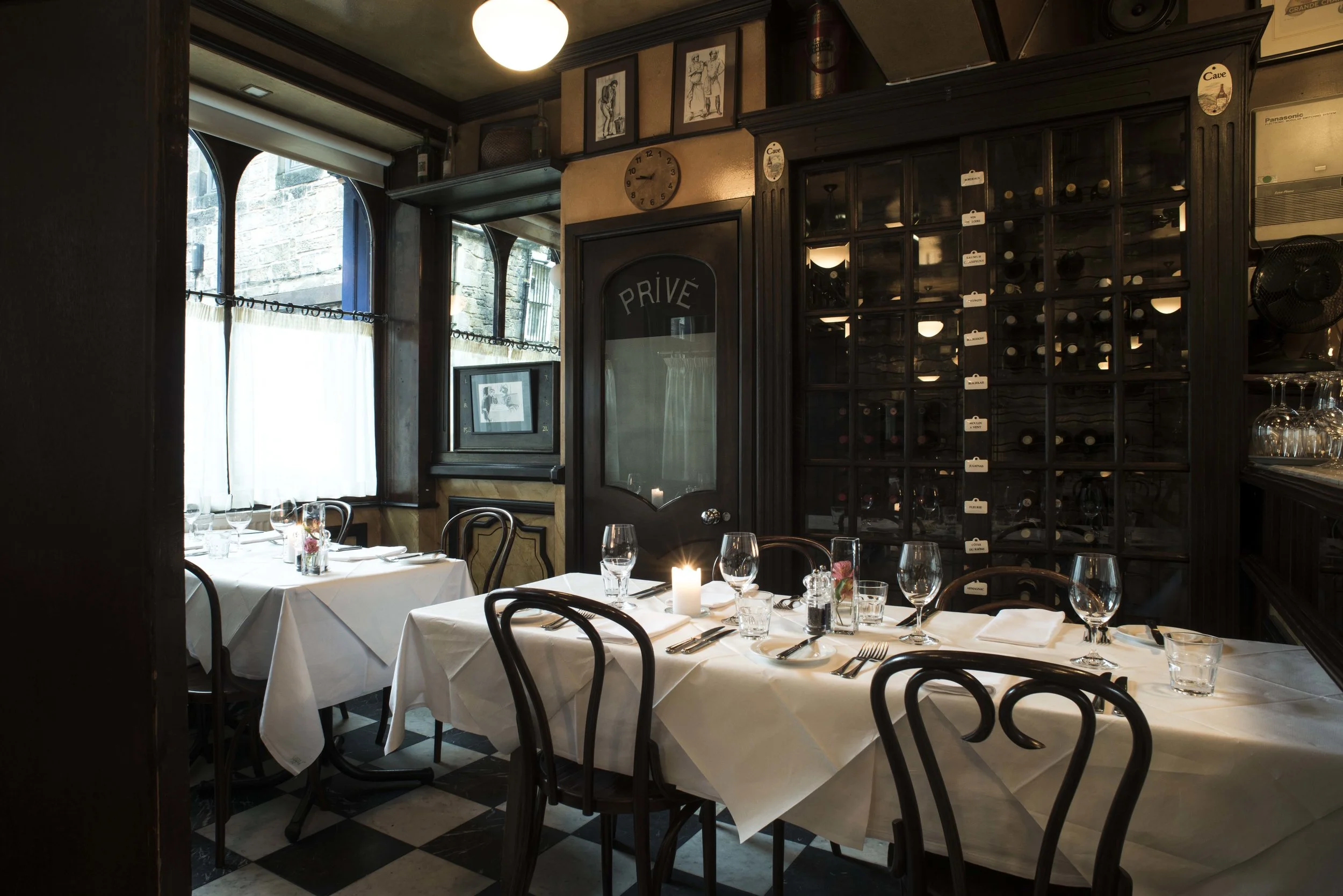 Cafe St Honore room set with wine rack.jpg
