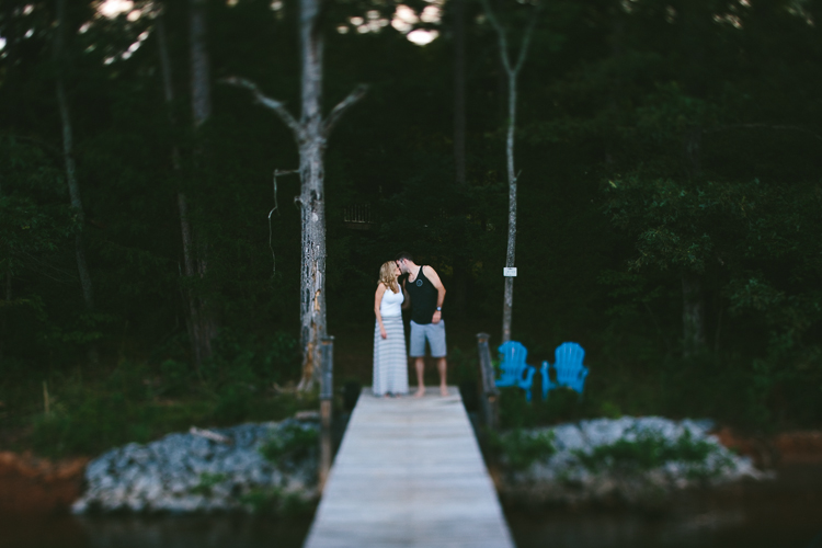 Engaged Couple Kissing on Boat Dock