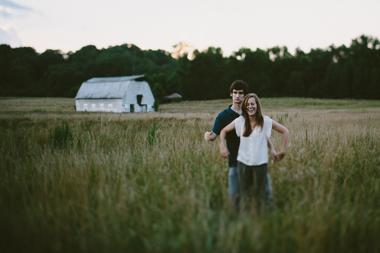 Playful Engaged Couple in Fields