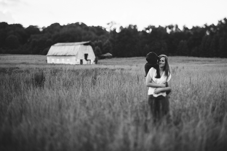 Black and White Shot of Couple in Field