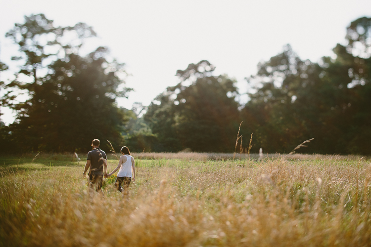 Couple Walking Through the Field