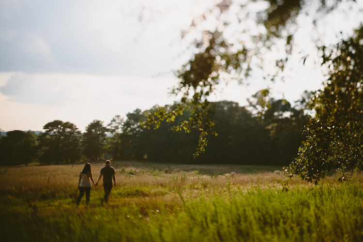 Couple Walking Through the Field