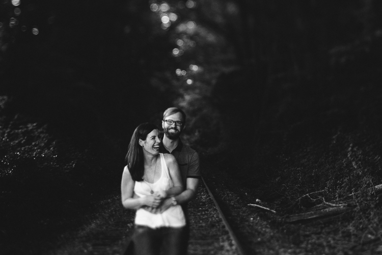 Black and White Shot of Couple on the Train Tracks