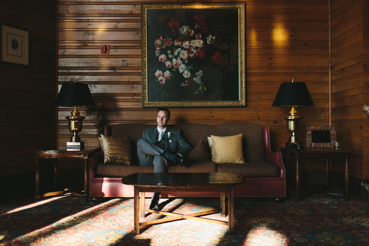 Groom sitting on the couch