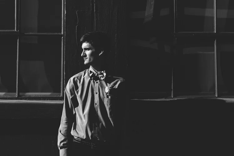 Black and white portrait of the groom