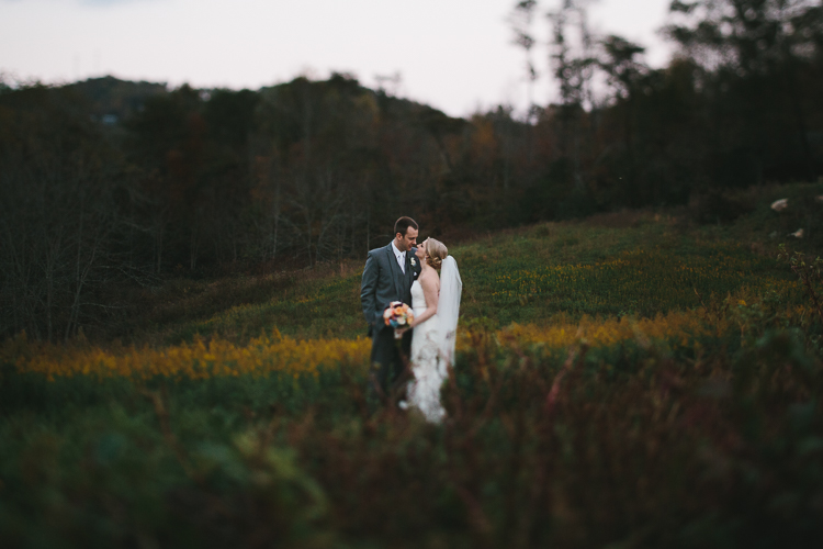 Bride and groom in golden rod field