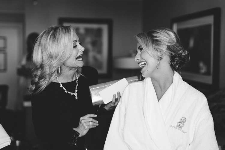 mother and daughter getting ready before wedding