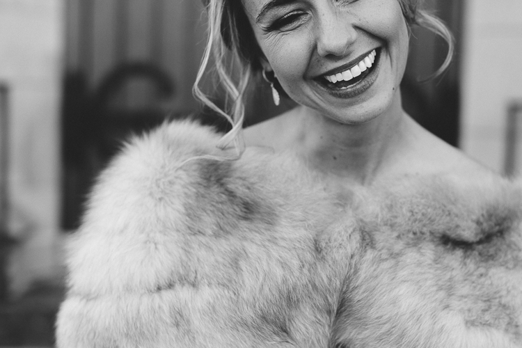 happy winter bride with her fur wrap