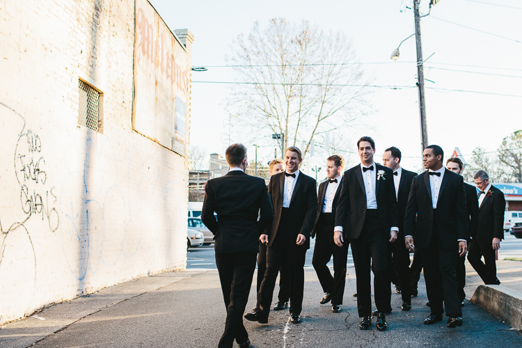 groom walking with his groomsmen