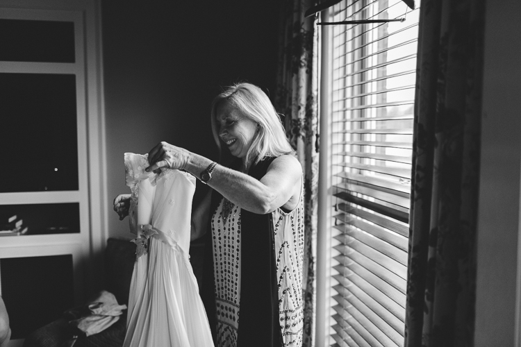mother helping the bride get ready