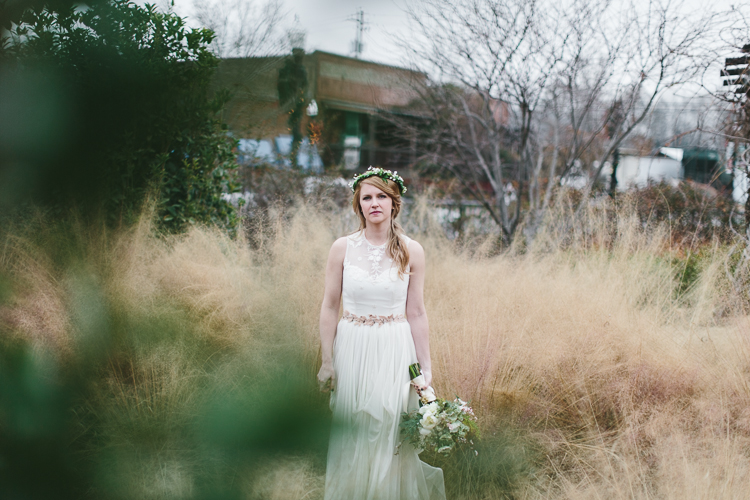 stunning shot of bohemian bride in tall grass