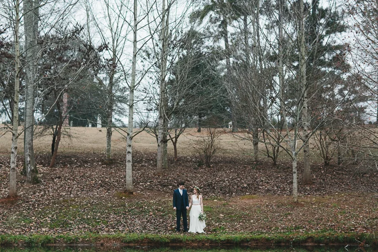 bride and groom portraits by pond