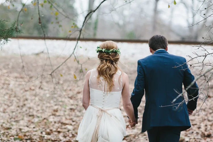 bride and groom walking from behind