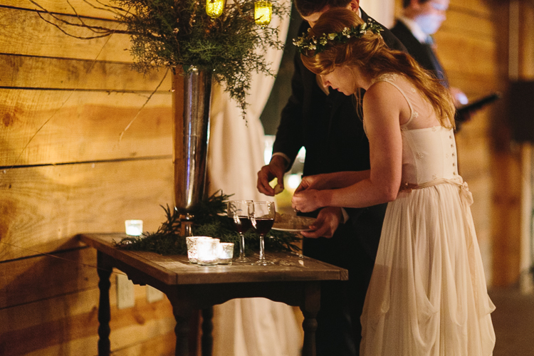 bride and groom taking communion during their wedding ceremony