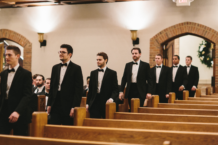 groomsmen walking in the church