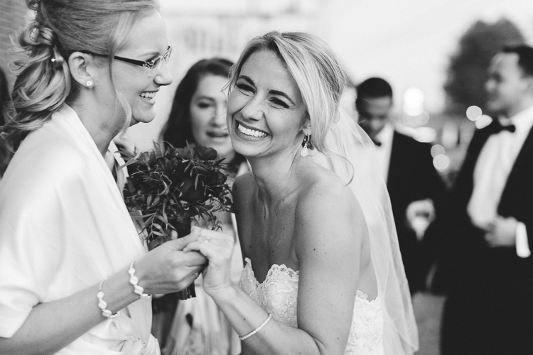 bride and sister after ceremony