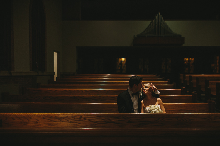 sweet moment between bride and groom in the church after the wedding
