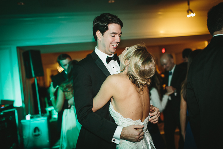 happy bride and groom dancing