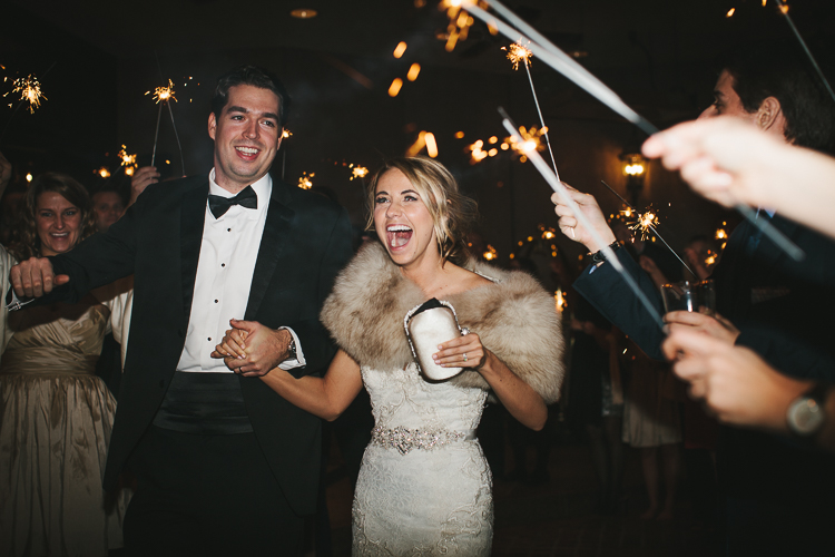 an excited bride and groom leaving for honey moon