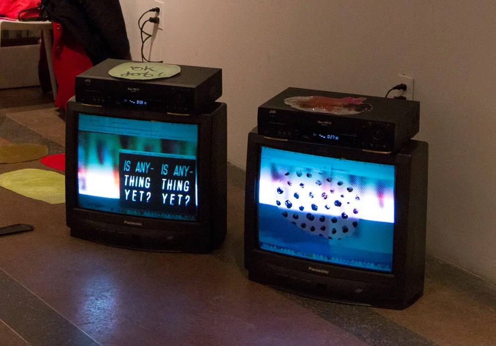 Documentation of Is Anything Yet animated gifs shown on box tv's with VHS players & interactive interface with static cling stickers 2015 Current Gallery - Baltimore, Maryland