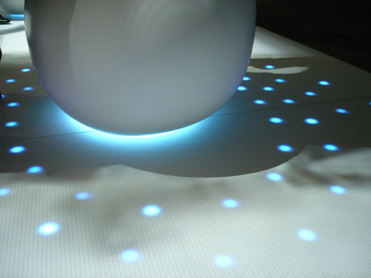 Hidden LEDs glow imitating a water ripple when pressure is sensed on the egg shaped seat. Design by Morris-Sato. Fabrication by Sterling Surfaces. Photo by Jeff Baumgart.