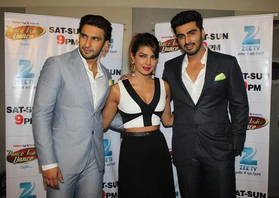Priyanka-Ranveer-Arjun have a blast on Dance India Dance 4 Arjun Kapoor, Ranveer Singh and Priyanka Chopra had a blast on reality show Dance India Dance , where Arjun and Priyanka revealed how the action choreographer had to put his foot down and insist that Ranveer control his energy on the sets of their upcoming Gunday . Even on the dance reality show, Ranveer would stand up and mimic grandmaster Mithun Chakraborty. "Can't help it much dada (Mithun), it's just his personality. There's little one can do to control the energizer bunny," laughed PC. The episode will air in India on Saturday 8 February 2014 on Zee TV.