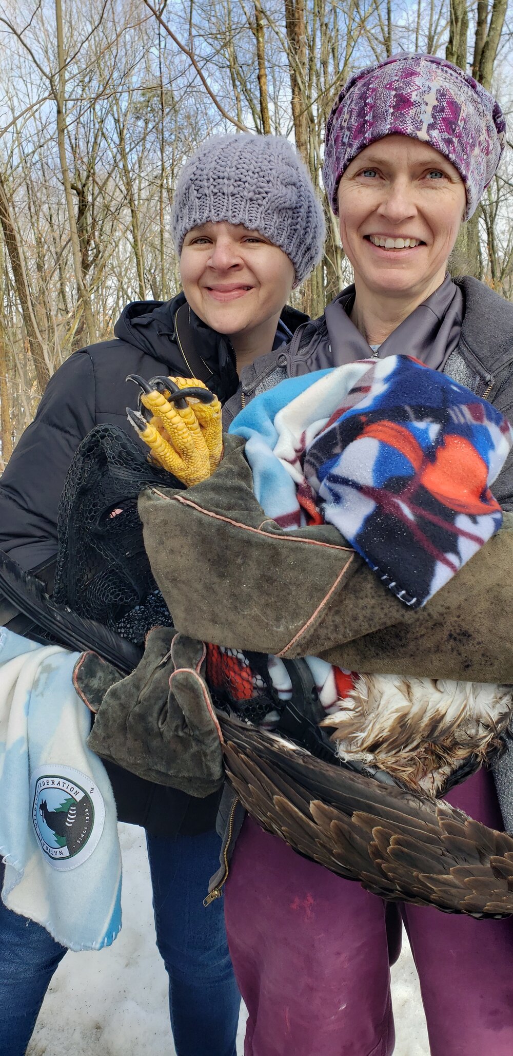  Cindy Saraceno pictured with injured juvenile Bald eagle being held by Christine Cummings, Wildlife Rehabilitator  Photo credit: Amy Poturnicki 
