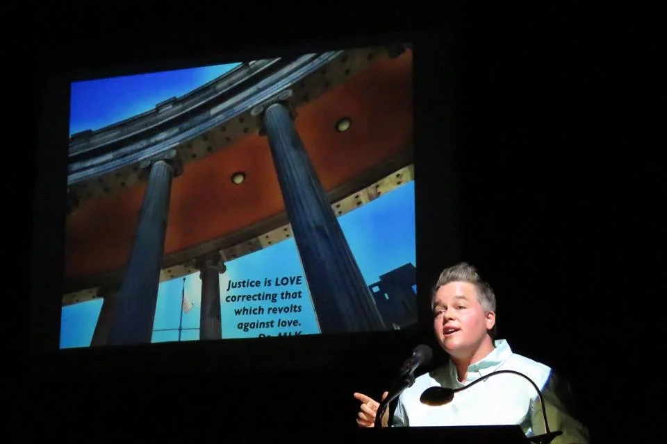 Sage speaking at PechaKucha, Maine