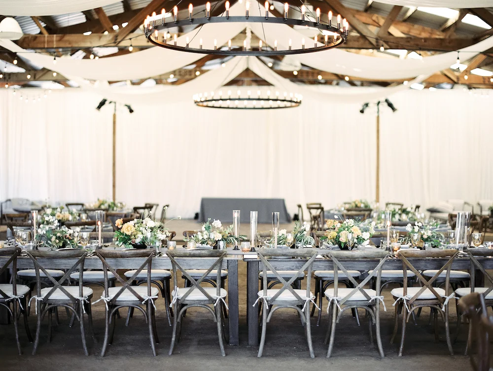 The head banquet table at this summer barn wedding in Marin County. Photo by Taralynn Lawton. Event Design by Jenny Schneider Events.