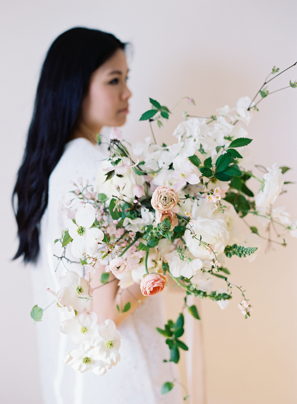  Dogwood, clematis, and ranunculus in blushed shades.  Photo by Meghan Mehan. 