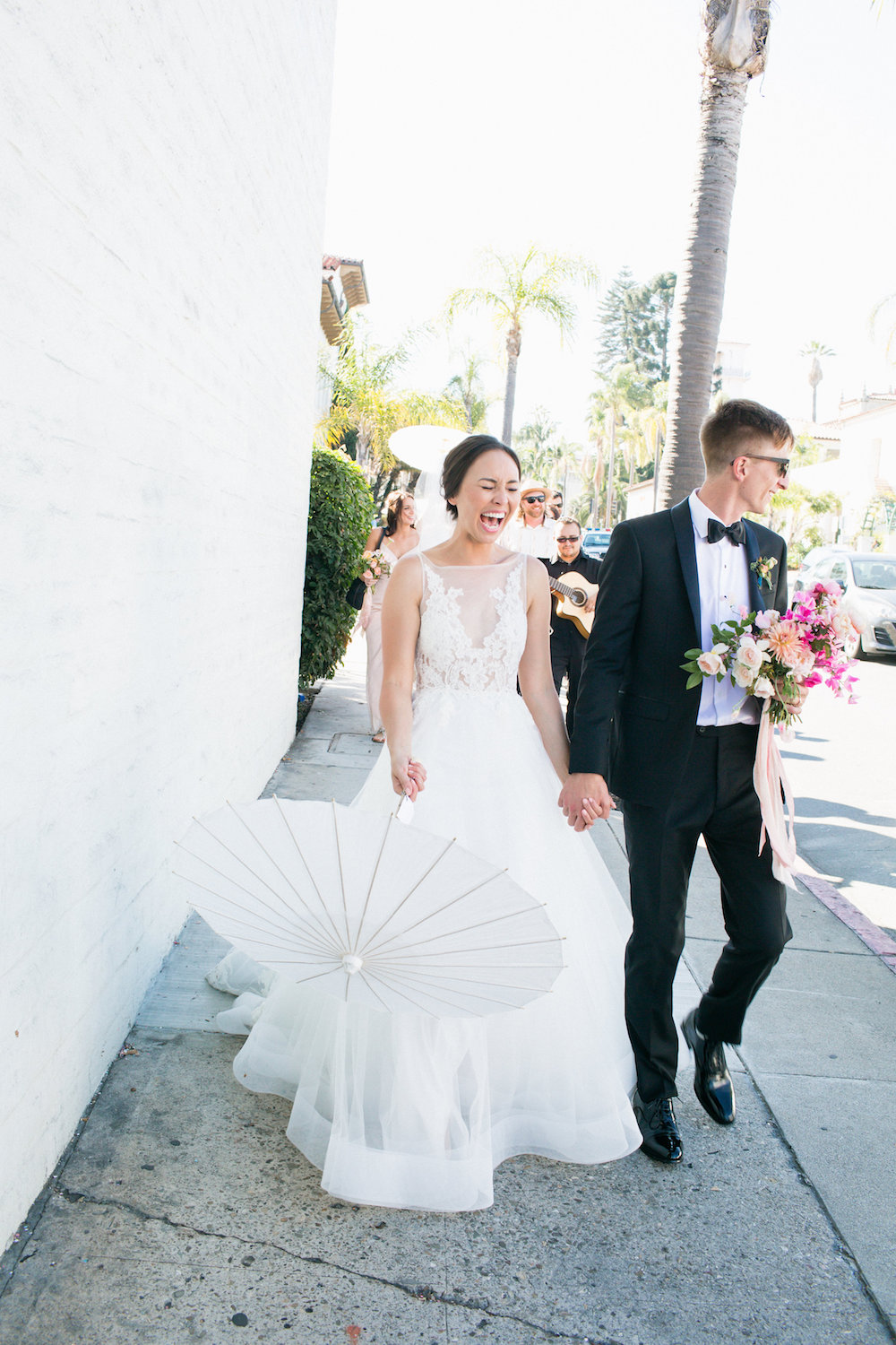  Melanie &amp; Dylan paraded through the streets of Santa Barbara after their wedding ceremony.  Photo by Max &amp; Friends.  Event Design by Carly Rae Weddings. 