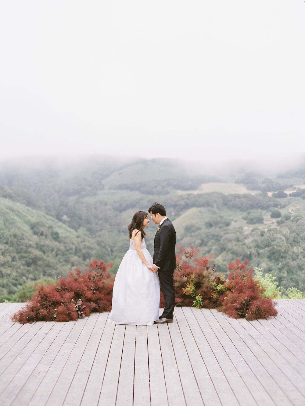  An altar installation of smokebush lined the lip of this hilltop platform overlooking Carmel Valley.  Photo by Michele Beckwith. Event Design by Lambert Floral Studio.As seen on Style Me Pretty. 