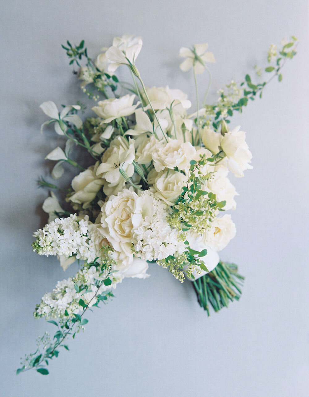  Creamy white flowers on a summer day… classic but never boring.   Photo by Ashley Sawtelle. Event Design by Bash Please. As see on BRIDES. 