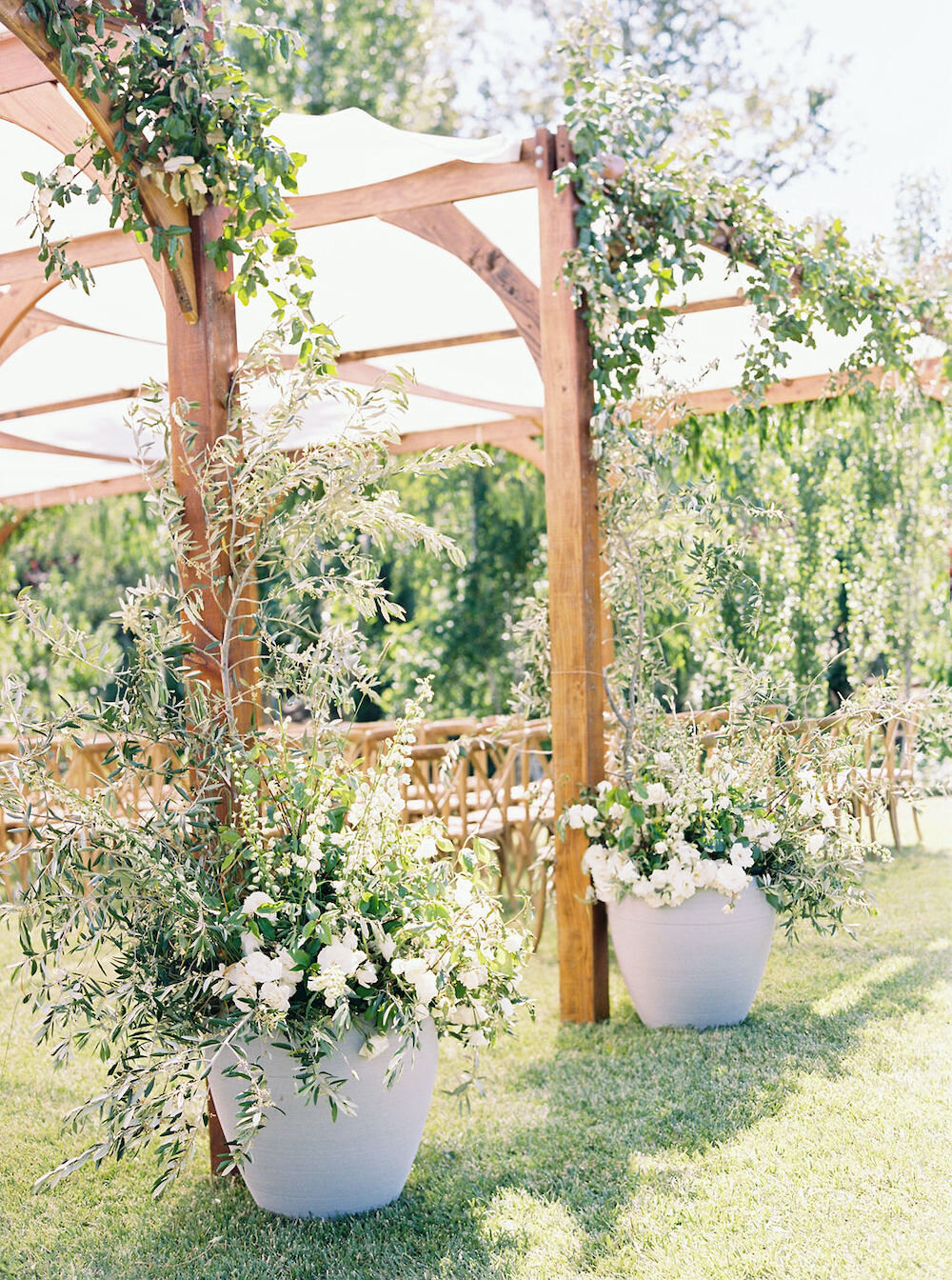  Every guest passed through this portal we adorned with Mediterranean foliage and garden flowers to find their seat. The last person to pass through that same portal? The bride herself.   Photo by Ashley Sawtelle. Event Design by Bash Please. As see 