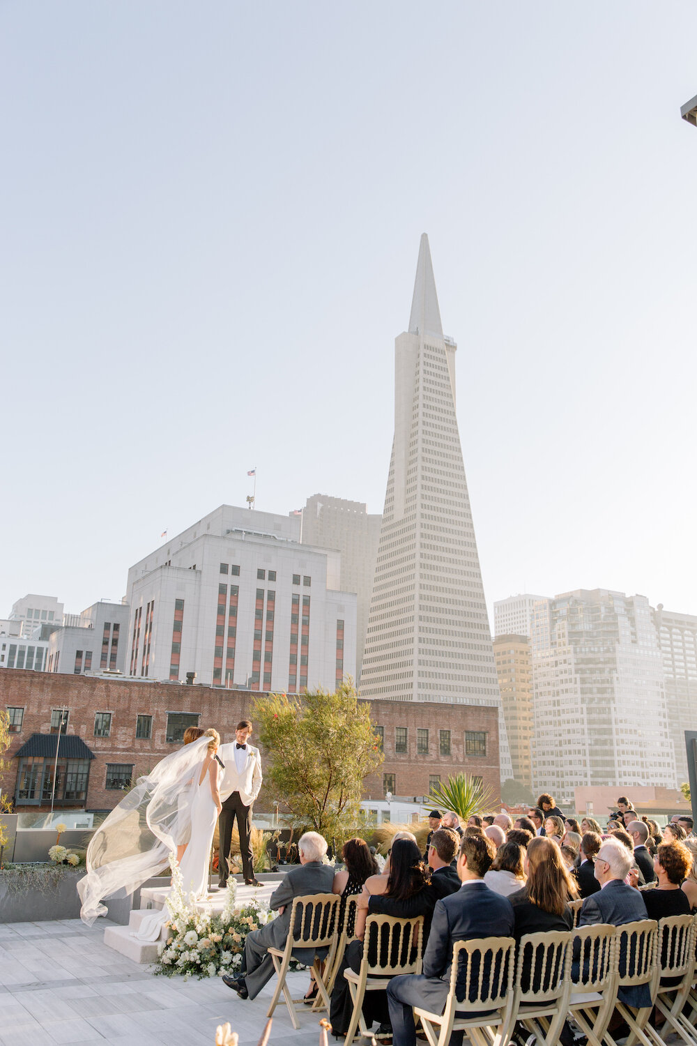  If you’re getting married literally within the San Francisco skyline, we’ll frame you from the bottom up - as if you’re floating in a garden cloud amongst the skyscrapers.   Photo by Christina McNeill. Event Design by Ruby &amp; Rose. As seen on BRI
