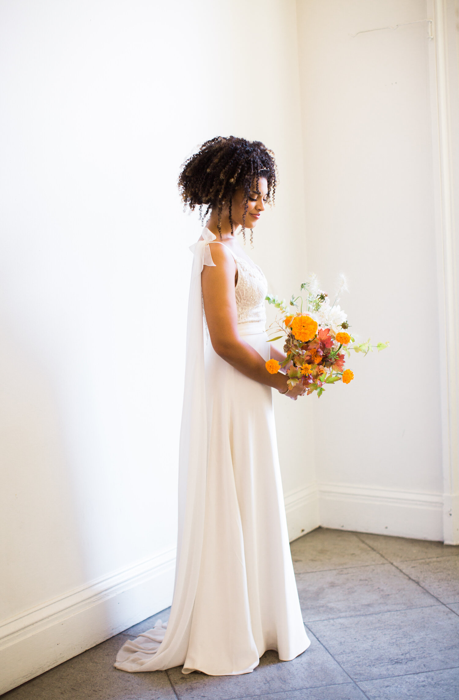  Pop o’ orange.    Photo by Birds of a Feather. Event Design by The Gingers. As seen on Martha Stewart Weddings. 