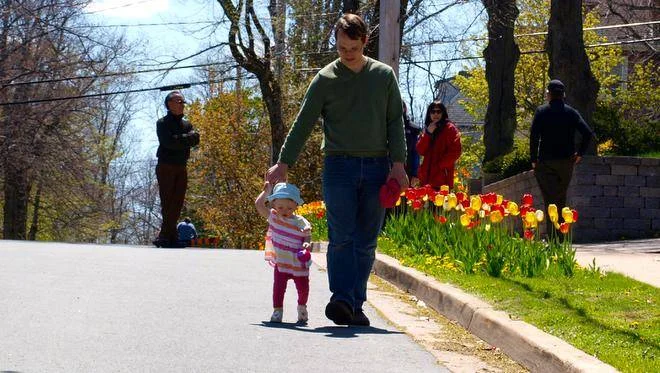 Founder, Sam Austin with his Daughter on Tulip Street. Image Courtesy of The Chronicle Herald