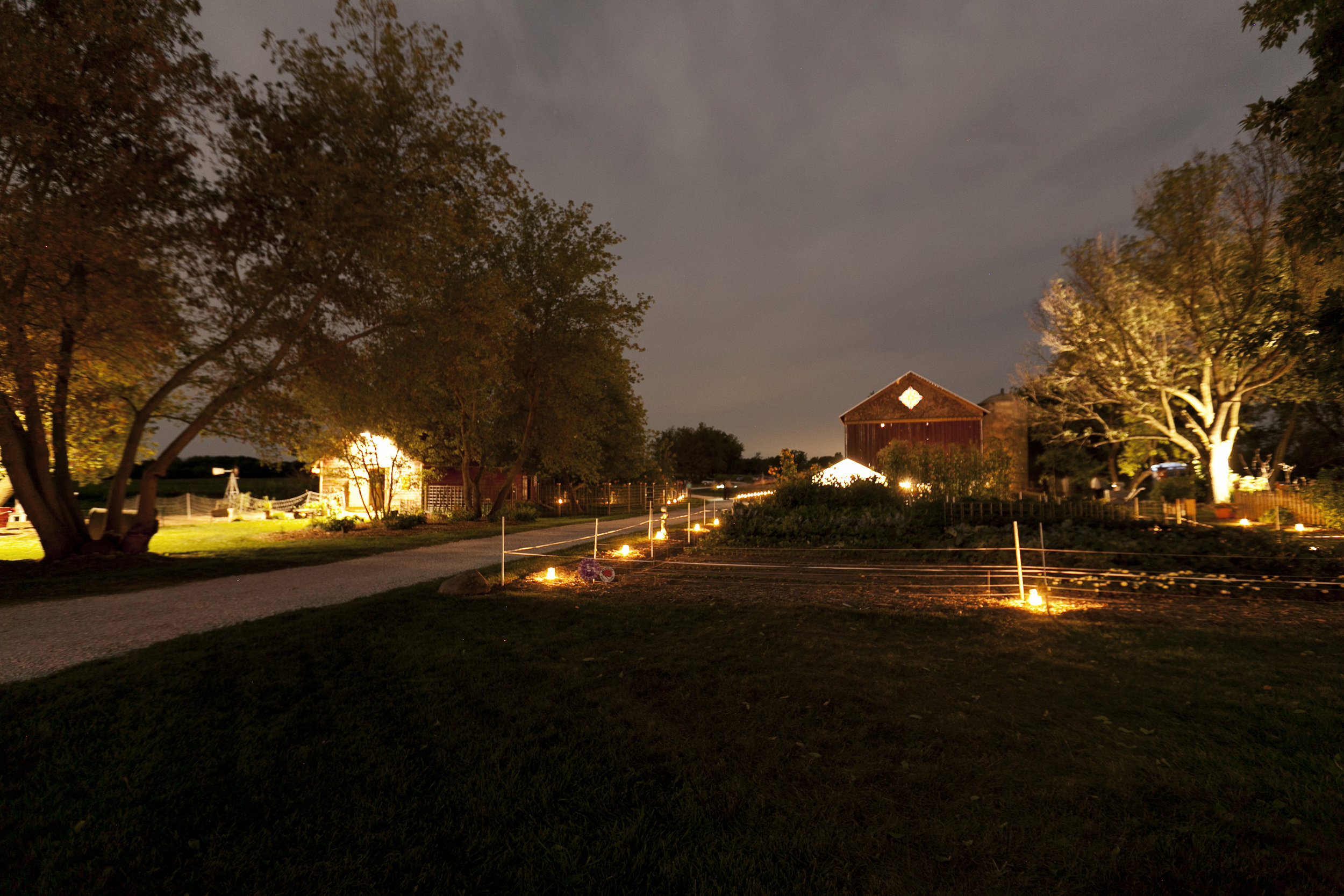 Outdoor lights guide guests down paths and illuminate the art-filled gardens. Image by Ellagraph Studios
