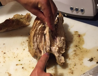 Here you can see the right side of the bird, which has already been carved, and the left side of the bird, where the breast is almost fully off of the body.