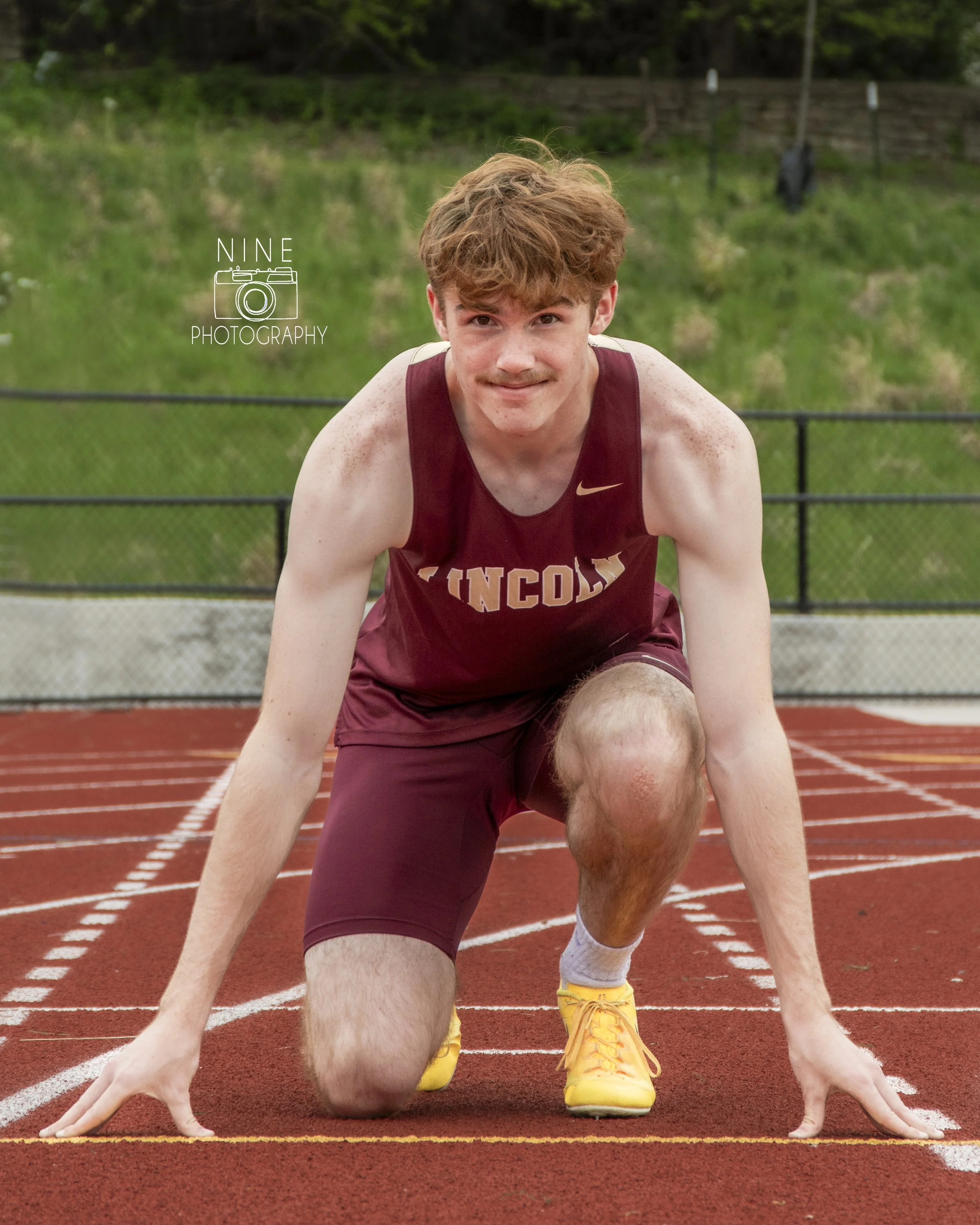 Mason - track - senior photos-5 logo.jpg
